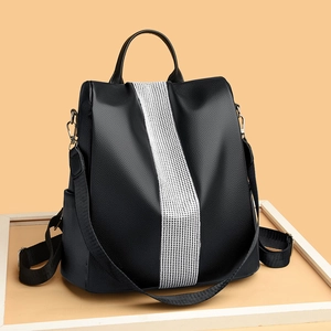 Chic black pebble grain leather backpack for women with sparkling silver rhinestone trim