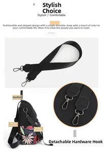 Detailed view of black backpack with red leaf pattern and detachable metal shoulder strap