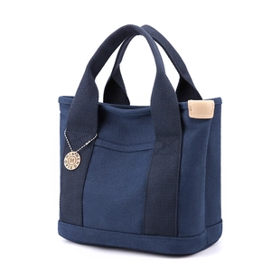 Minimalist navy blue canvas handbag with large capacity and multi-compartment design