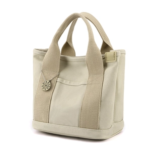 Minimalist beige canvas tote bag with multi-pockets and reinforced wide handles