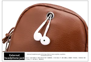 Detail of soft brown lychee grain leather with high-density metal external earphone hole