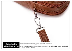 Detail of detachable brown shoulder strap with premium metal hook on PU leather bag
