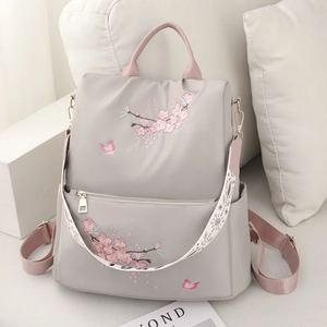 Grey nylon backpack with pink cherry blossom embroidery and stylish printed wide strap