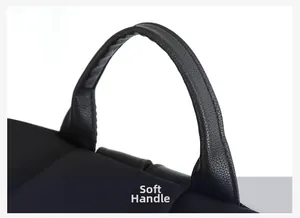 Detail of the soft pebble grain leather top handle on a black lightweight backpack