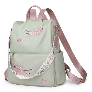 Green nylon women backpack with pink cherry blossom embroidery and wide pattern strap