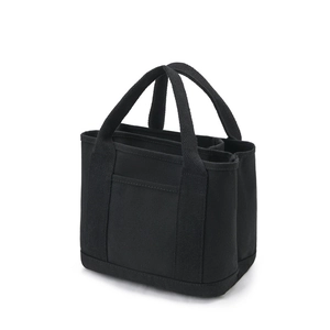 Minimalist black canvas tote bag with front pocket and multi-compartment design