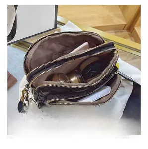 Close-up of three-layer quilted crossbody bag showing spacious interior and compartments