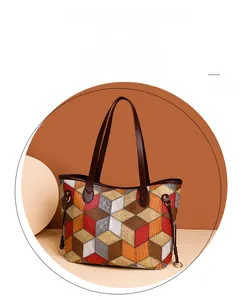 Detail of colorful 3D geometric patchwork tote bag with high-quality PU leather texture