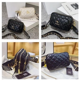 Detail of quilted crossbody bag with golden kangaroo logo and three zipper layers