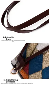 Detail of multi-color patchwork faux leather tote with gold hardware and smooth brown handle