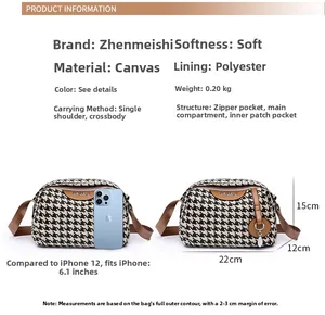 Detailed size comparison of houndstooth canvas crossbody bag next to a smartphone