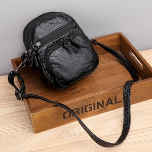 Women black PU leather crossbody bag with multiple zippers and textured finish