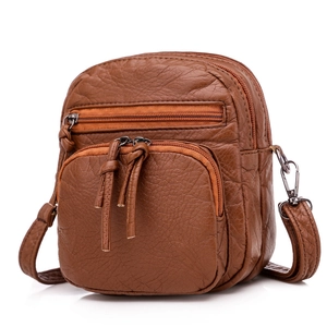 Brown faux leather crossbody bag with multiple zip compartments and litchi texture