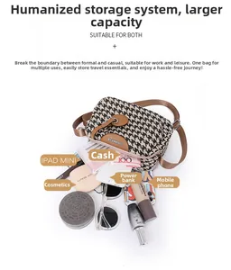 Detail view of houndstooth shoulder bag showing large capacity for phone and cosmetics