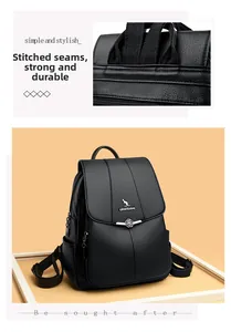 Detailed view of black litchi texture PU leather backpack with kangaroo logo and stitching