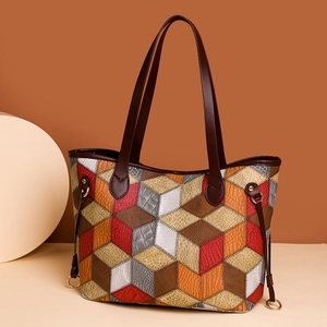 Minimalist patchwork tote bag with multi-color faux leather panels and top handles