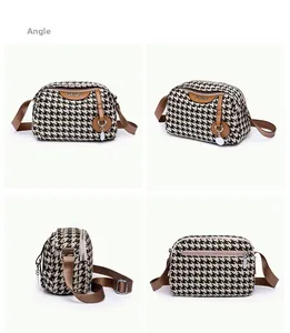 Multi-angle views of houndstooth crossbody bag with brown faux leather trim and silver charm