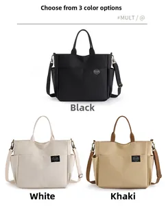 Trois grands sacs cabas en toile noirs, blancs et kakis avec doubles anses et bandoulières