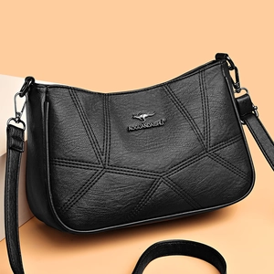 Chic black faux leather crossbody bag with geometric stitching and metal kangaroo emblem