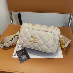 White quilted crossbody bag with golden kangaroo logo and wide woven shoulder strap