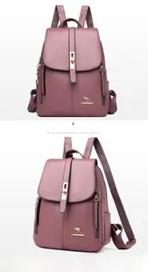 Detail view of taro purple leather backpack with lychee texture and gold hardware