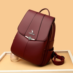 Chic dark red faux leather backpack with kangaroo logo and elegant metal floral details