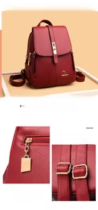 Detail view of red textured PVC backpack with golden hardware and buckle lock system