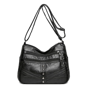Vintage black soft leather crossbody bag with multi-zipper pockets and rivet details