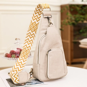 Beige soft leather crossbody chest bag with geometric pattern wide woven shoulder strap