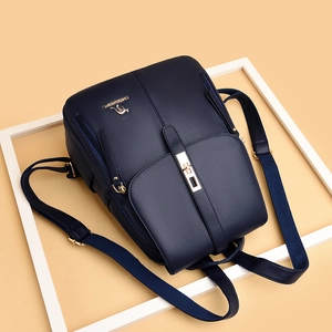 Navy blue lychee leather backpack with golden kangaroo logo and anti-theft flap lock