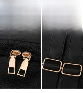 Detail of high-quality gold hardware and polished zipper on black lychee pattern leather