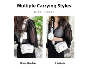 Detailed view of white quilted PU crossbody bag featuring heart decor and round coin pouch