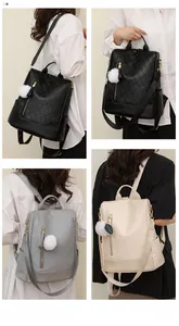 Detail of soft PU leather backpack with quilted pattern and decorative leaf charm