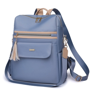 Blue casual anti-theft backpack with fringe charm and water-resistant nylon texture