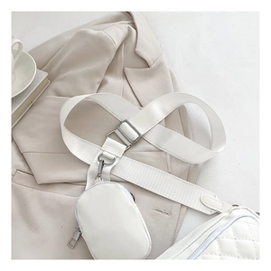 Detailed view of white quilted PU leather crossbody bag with detachable mini round coin purse