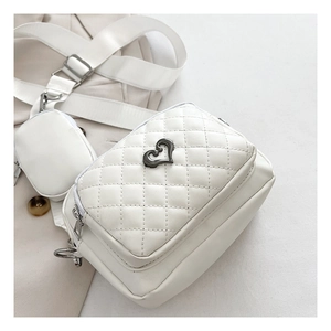White PU leather crossbody bag featuring quilted heart buckle and removable round coin purse