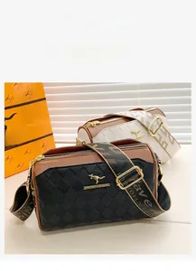 Close-up of quilted pattern leather bags with branded kangaroo logo and wide straps