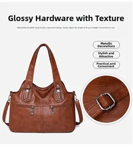 Detail of brown faux leather tote with adjustable shoulder strap and glossy hardware