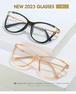 Detailed view of cat-eye TR90 blue light blocking glasses in black and transparent orange