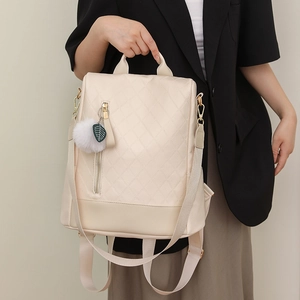 Chic cream white PU leather backpack with quilted pattern and plush ball charm decoration
