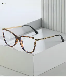Detail view of cat eye leopard print frames with textured gold metal and black temple arms