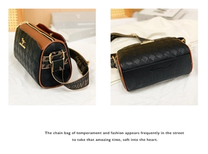Close-up of quilted leather pillow bag with contrast trim and embossed kangaroo logo