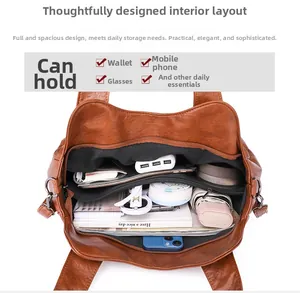Detail view of large brown soft leather handbag interior showing organized compartments