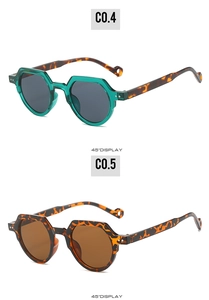 Close-up of geometric sunglasses in mint green and tortoise shell frames at 45-degree angle