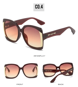 Detail view of burgundy square frame sunglasses with golden metal trim and gradient lenses