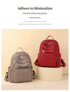 Detail of quilted nylon backpacks in taupe and wine red with gold zippers and side pockets