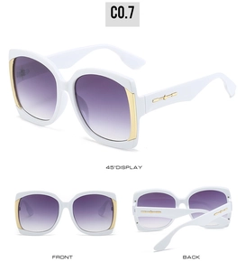 Detail of white square frame sunglasses with golden cross-star metal accents and gradient lenses