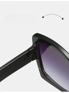 Macro detail of black sunglasses featuring a durable metal hinge and purple gradient lenses