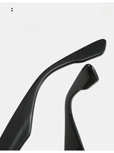 Close-up of curved glossy black temples of summer sunglasses for comfortable wear