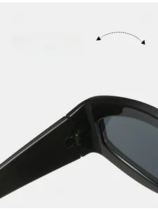 Detail of durable metal hinges on sleek black cat-eye sunglasses for long-lasting use